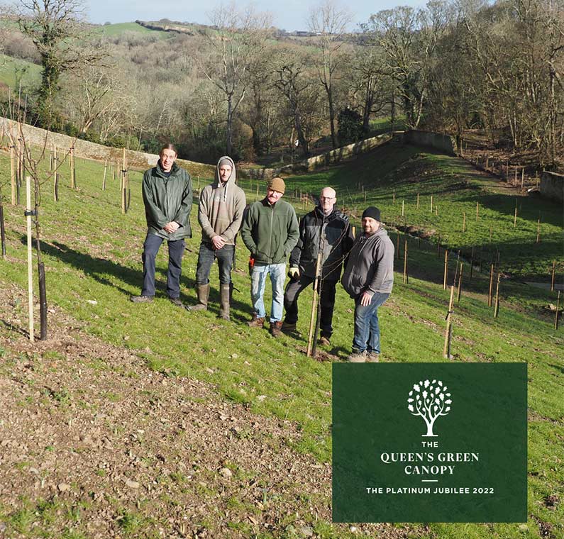 The Caerhays gardening team at the Old Kitchen Garden where around 200 Malus trees have been planted Caerhays Estate