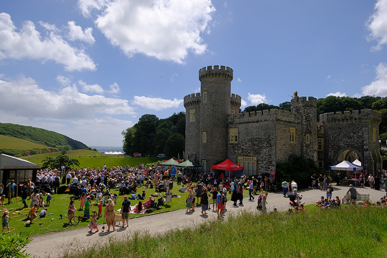 Small crowd of visitors at Caerhays Castle and Gardens Summer Fete